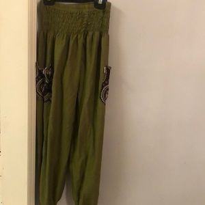 Elephant pants. Olive green,black print pockets. Pilling on upper thigh